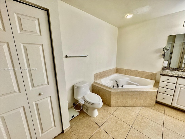 bathroom with tile patterned floors, tiled bath, vanity, and toilet