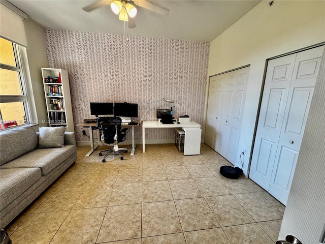 tiled office space with ceiling fan