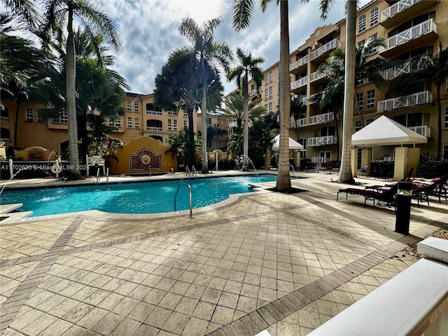 view of pool with pool water feature