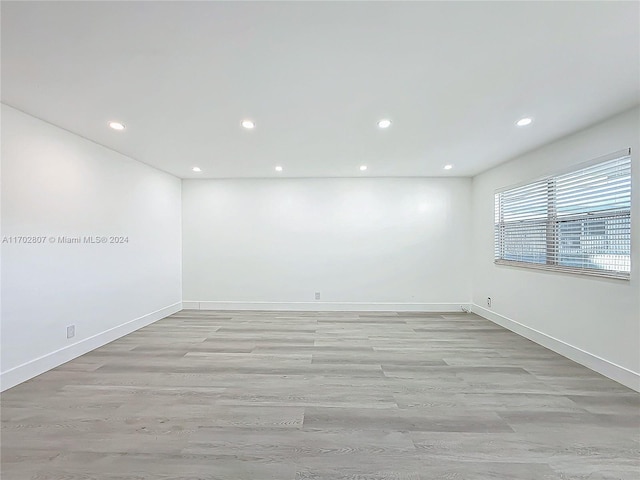 unfurnished room featuring light wood-type flooring