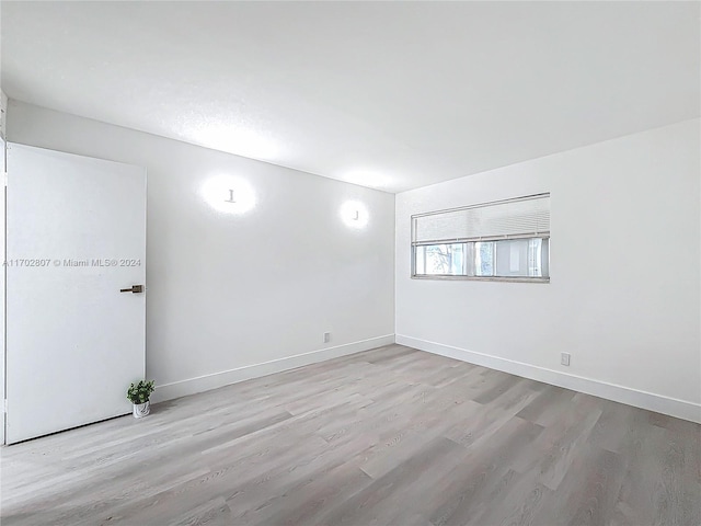 unfurnished room featuring light wood-type flooring