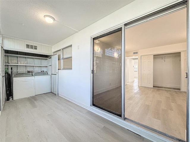 interior space featuring a patio and separate washer and dryer