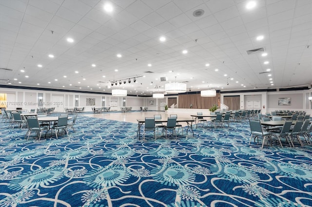 carpeted dining space featuring recessed lighting