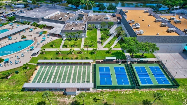 bird's eye view of a large body of water and a pool area