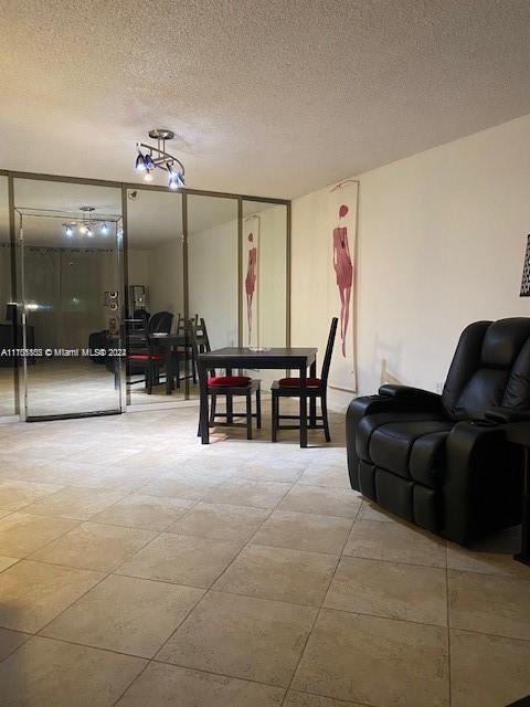 dining area with a textured ceiling