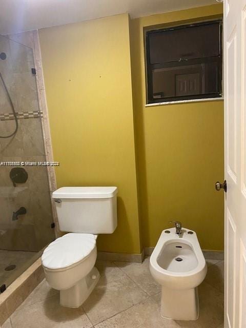 bathroom with tiled shower, tile patterned floors, a bidet, and toilet