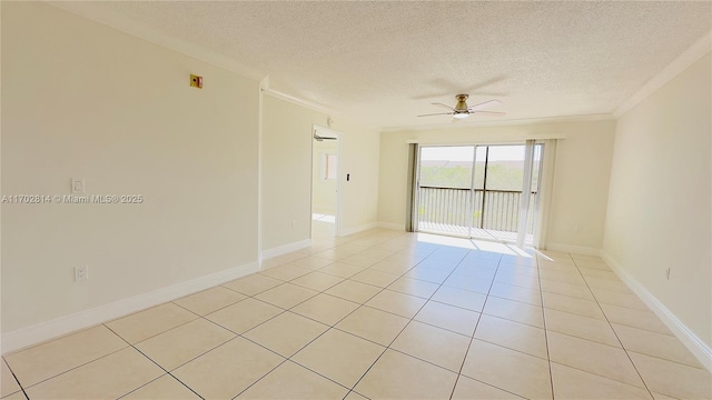 tiled empty room featuring crown molding, a textured ceiling, and ceiling fan