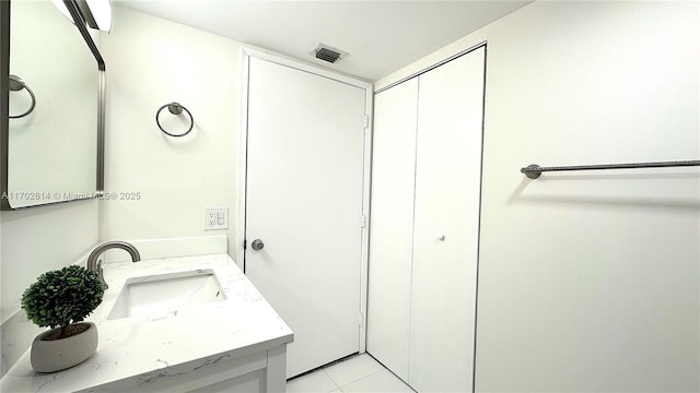 bathroom with vanity and tile patterned flooring