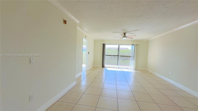 spare room featuring crown molding, ceiling fan, light tile patterned flooring, and a textured ceiling