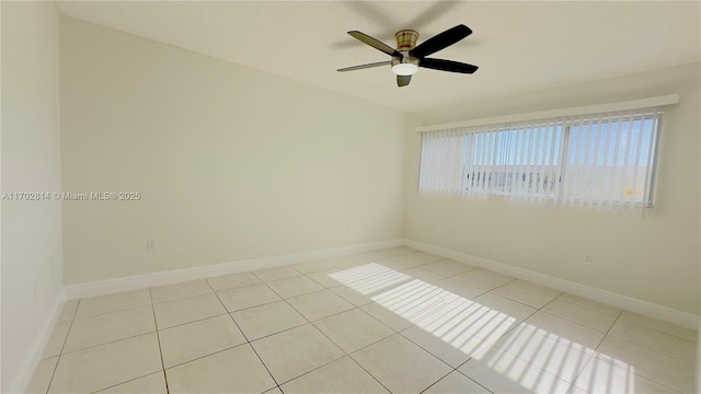 tiled empty room with ceiling fan