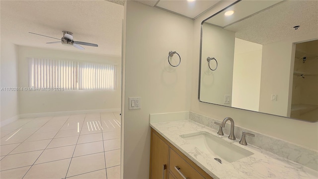 bathroom with vanity, a textured ceiling, tile patterned floors, and ceiling fan