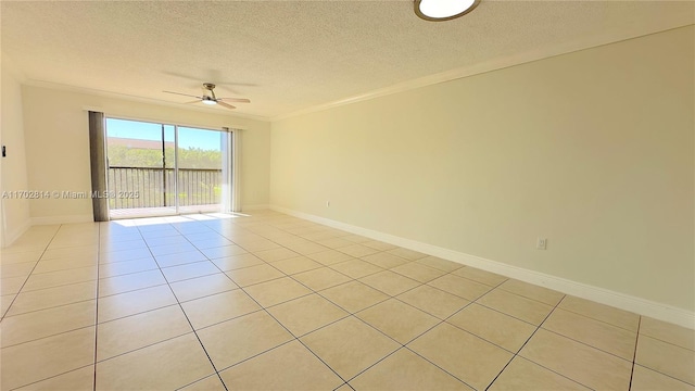 tiled spare room with crown molding, ceiling fan, and a textured ceiling