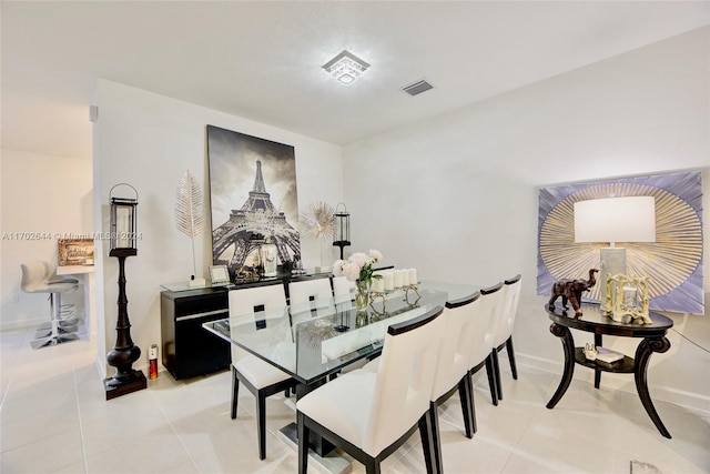 dining space with light tile patterned floors