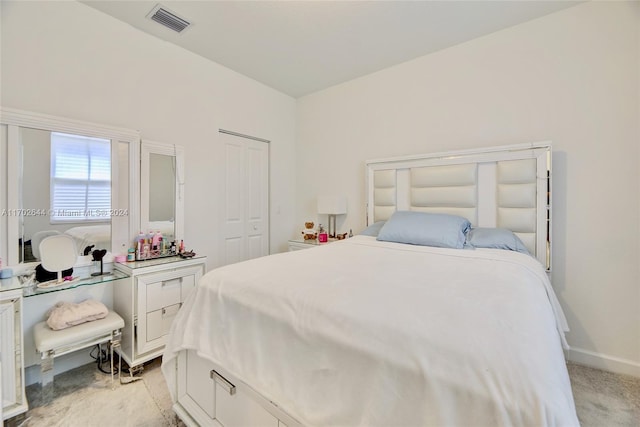 carpeted bedroom with a closet