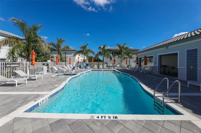 view of swimming pool featuring a patio