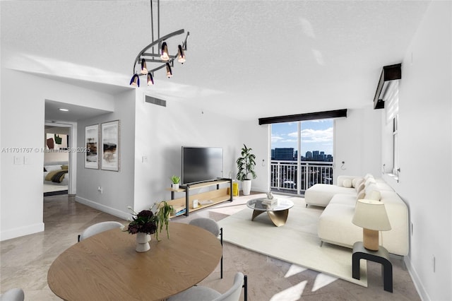 3000 Coral Way Unit 1502, Miami, FL 33145 - living area featuring a textured ceiling, baseboards, a wall of windows, and a chandelier