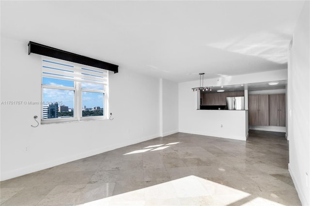 3000 Coral Way Unit 1502, Miami, FL 33145 - unfurnished living room featuring baseboards