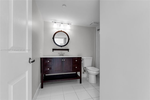 3000 Coral Way Unit 1502, Miami, FL 33145 - bathroom with toilet, vanity, and tile patterned floors