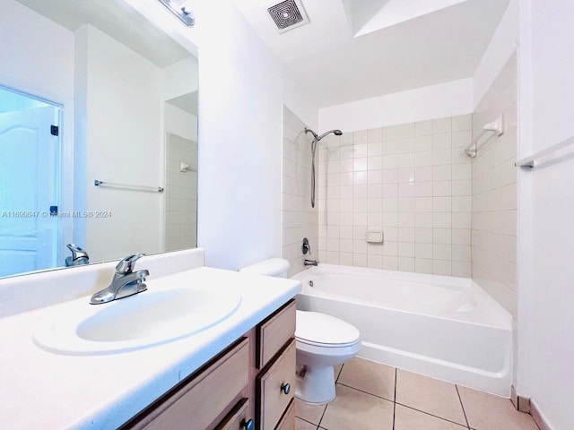 full bathroom with tile patterned flooring, vanity, toilet, and tiled shower / bath