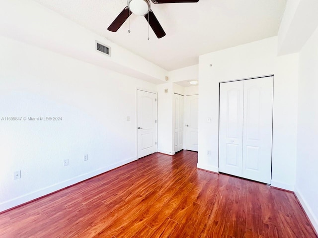 unfurnished bedroom featuring ceiling fan and hardwood / wood-style floors