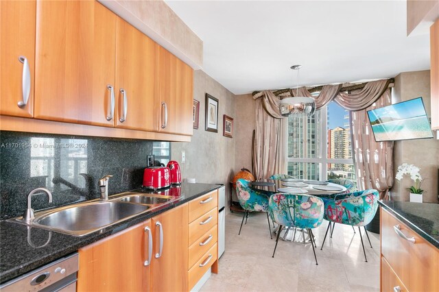 16500 Collins Ave Unit 1451, Sunny Isles Beach, FL 33160 - kitchen with a sink, dark stone counters, dishwasher, and brown cabinetry