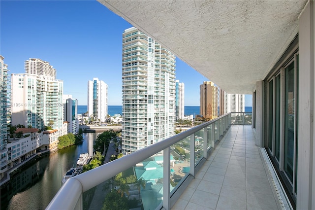 balcony featuring a water view