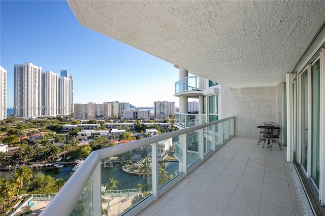 balcony featuring a water view