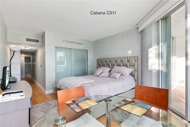 16500 Collins Ave Unit 1451, Sunny Isles Beach, FL 33160 - bedroom featuring light wood-style floors, a closet, and baseboards