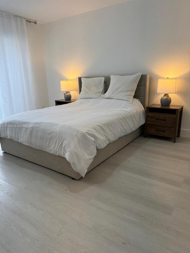 bedroom featuring hardwood / wood-style floors