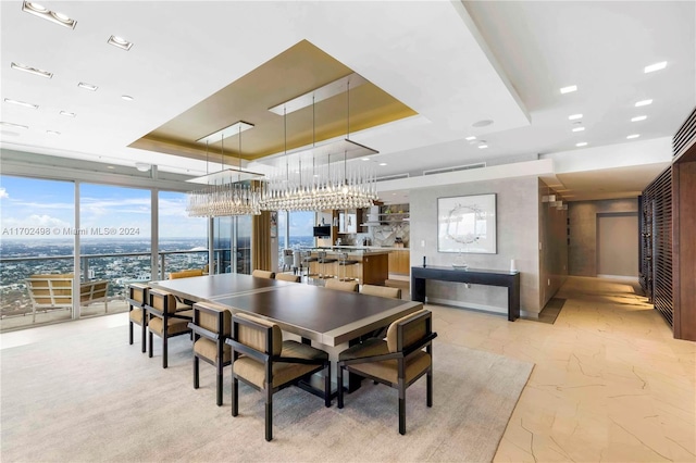 dining space featuring a tray ceiling