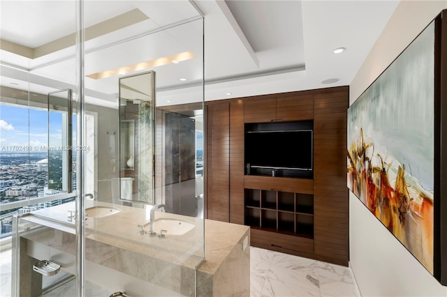 bathroom with vanity and a shower with door