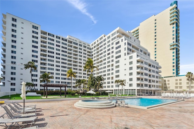 view of swimming pool featuring a patio area and a pergola