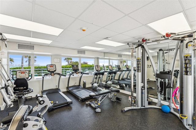 gym featuring a drop ceiling