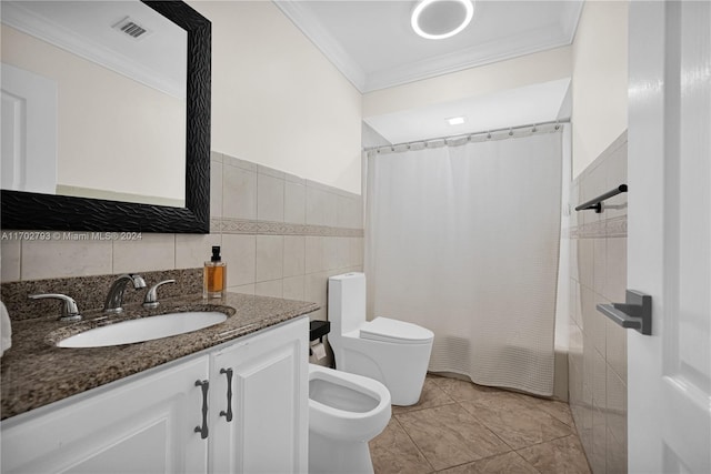 full bathroom with tile patterned floors, vanity, shower / tub combo with curtain, tile walls, and toilet