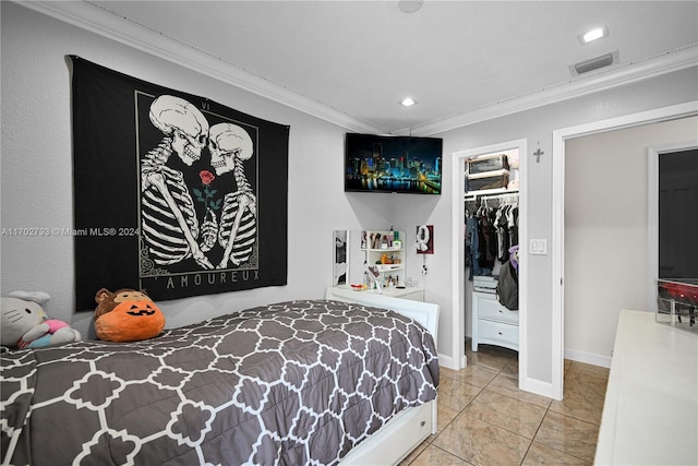 bedroom with ornamental molding and a closet