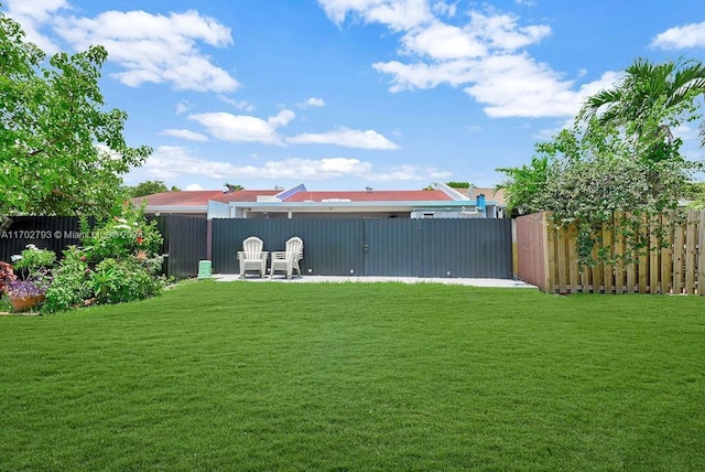 rear view of house featuring a lawn
