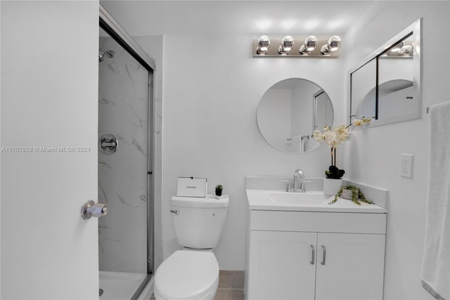 bathroom featuring walk in shower, vanity, and toilet