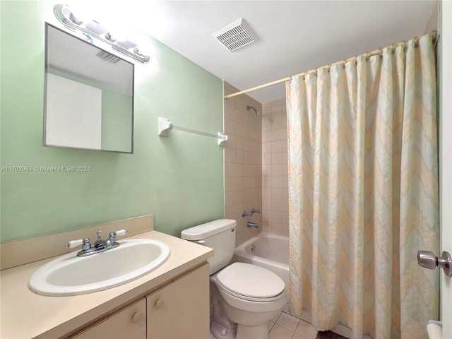 full bathroom featuring tile patterned floors, vanity, shower / bathtub combination with curtain, and toilet