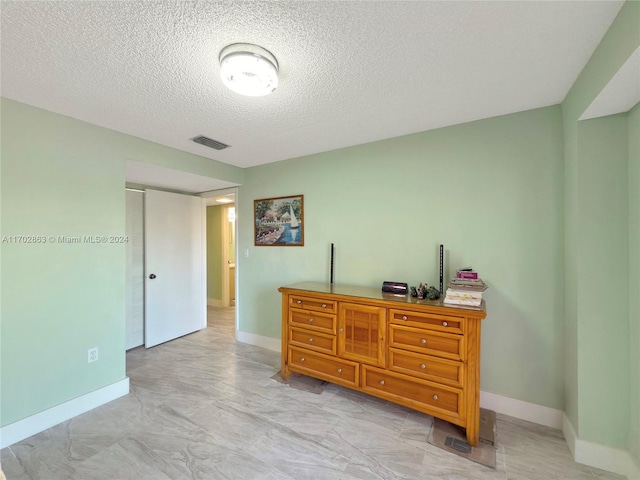 bedroom with a textured ceiling