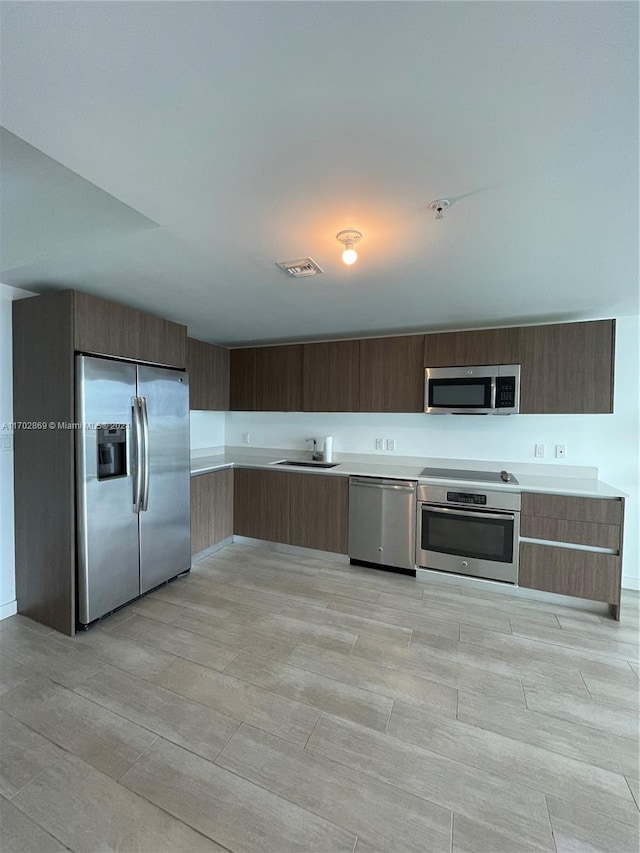 kitchen featuring stainless steel appliances and sink