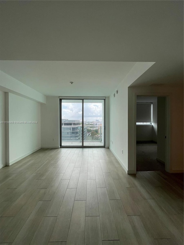 empty room with light wood-type flooring