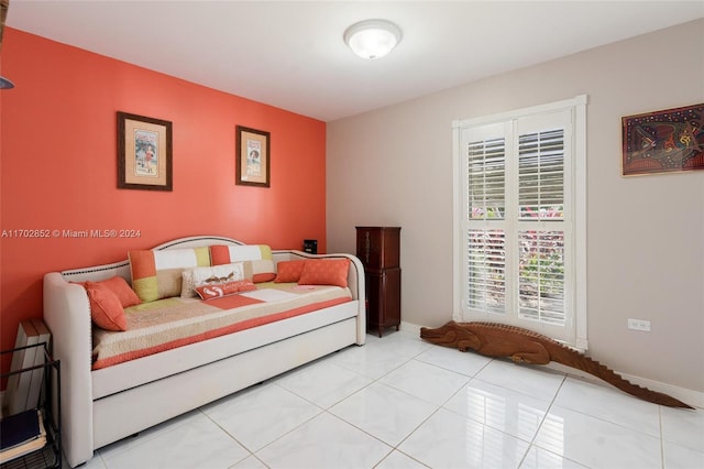 bedroom featuring light tile patterned floors