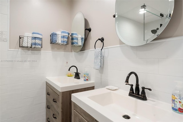 bathroom featuring vanity and tasteful backsplash