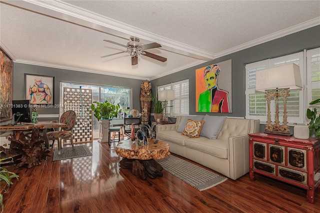 living room with wood-type flooring, a textured ceiling, ceiling fan, and crown molding