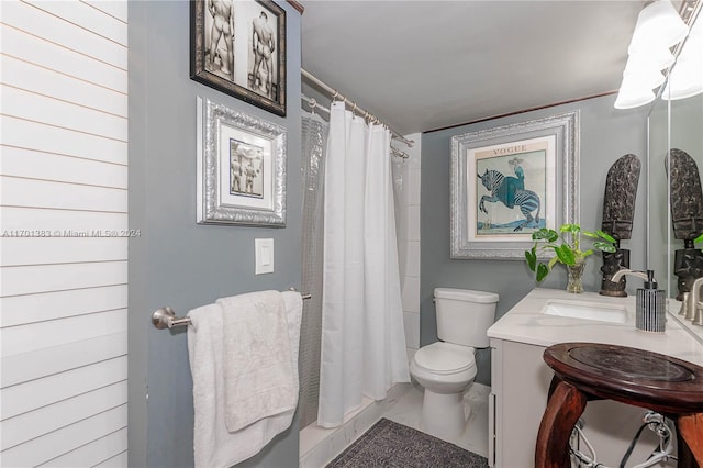 bathroom featuring vanity, toilet, and walk in shower