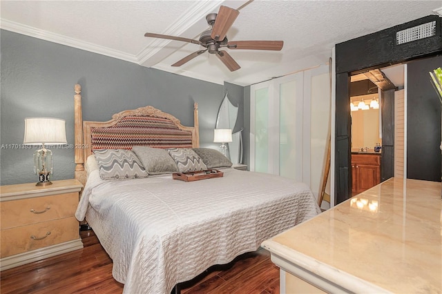 bedroom featuring ceiling fan, ornamental molding, a textured ceiling, connected bathroom, and dark hardwood / wood-style flooring