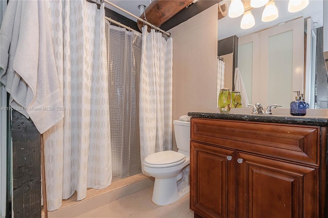 bathroom with tile patterned floors, vanity, a shower with shower curtain, and toilet