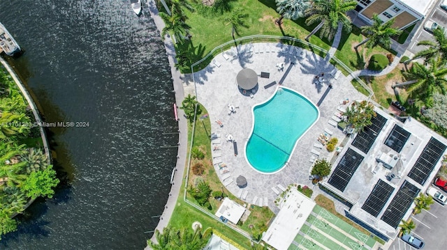 birds eye view of property with a water view