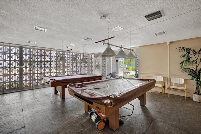 recreation room featuring a textured ceiling and pool table