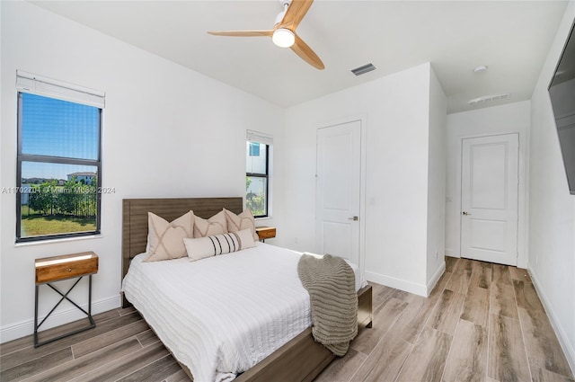 bedroom featuring ceiling fan and light hardwood / wood-style floors